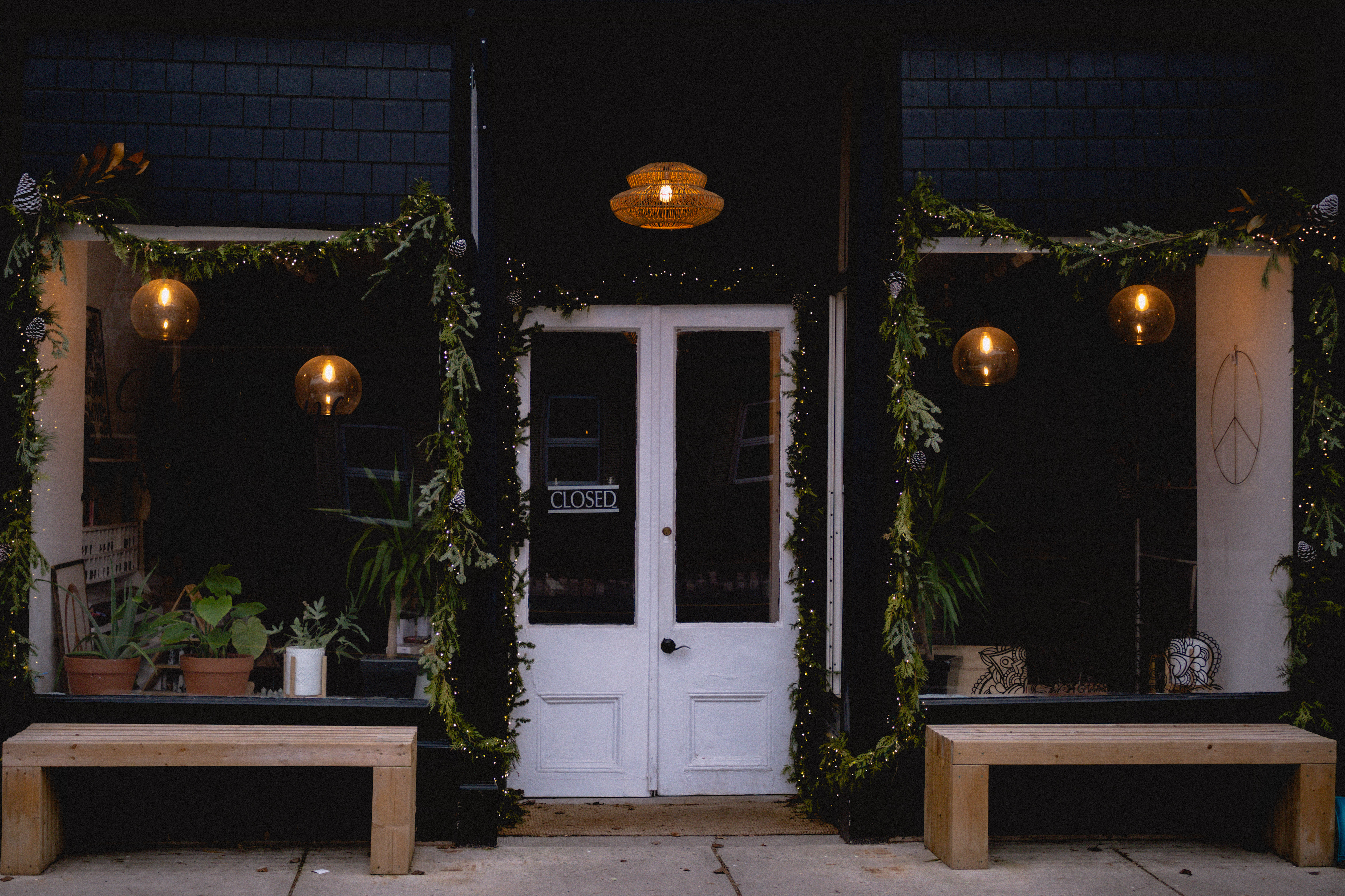 A warmly lit storefront while traveling
