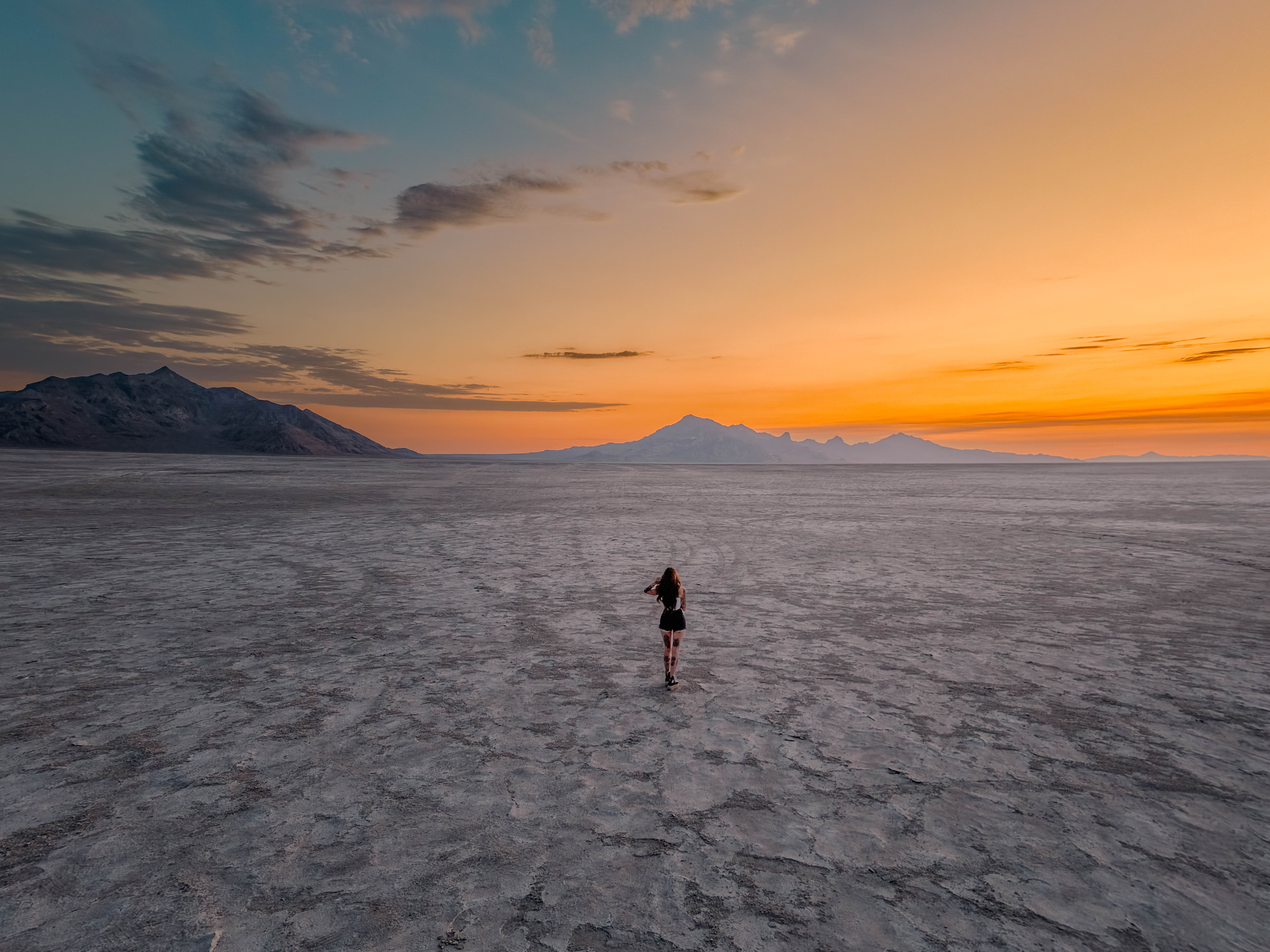 A wide desert landscape at sunset